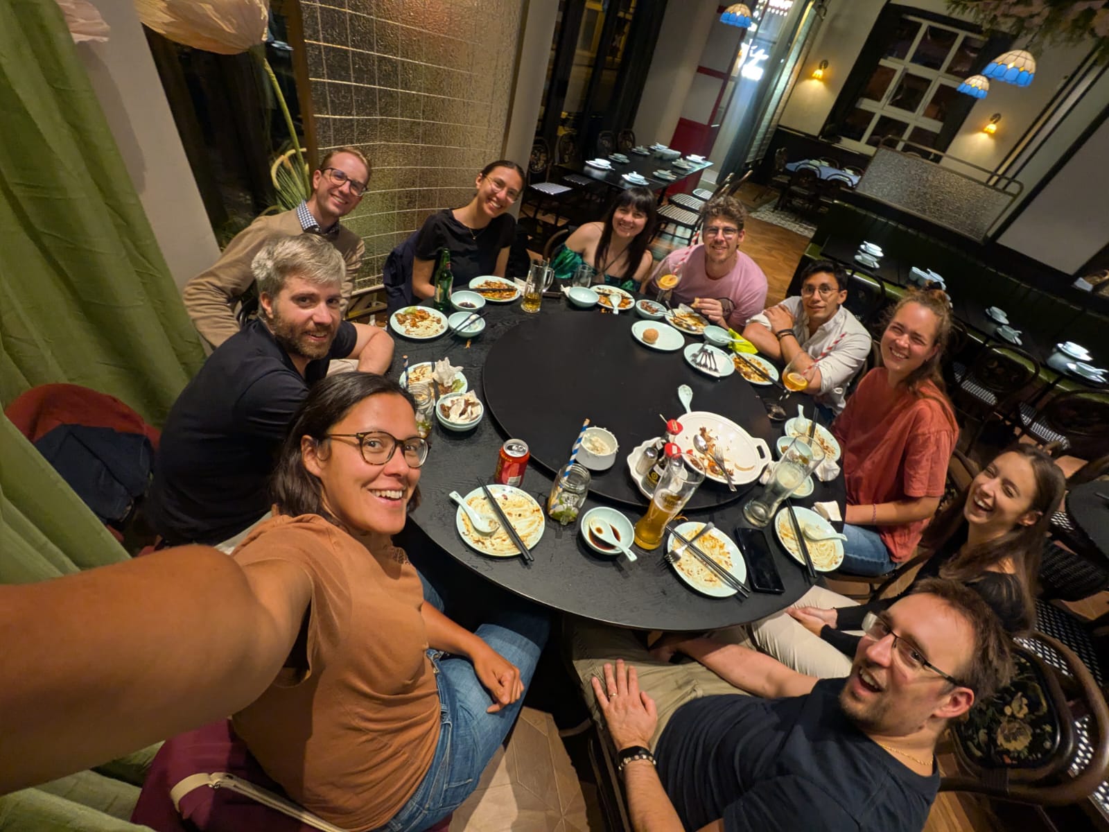 MLCast community members sharing a meal at a restaurant